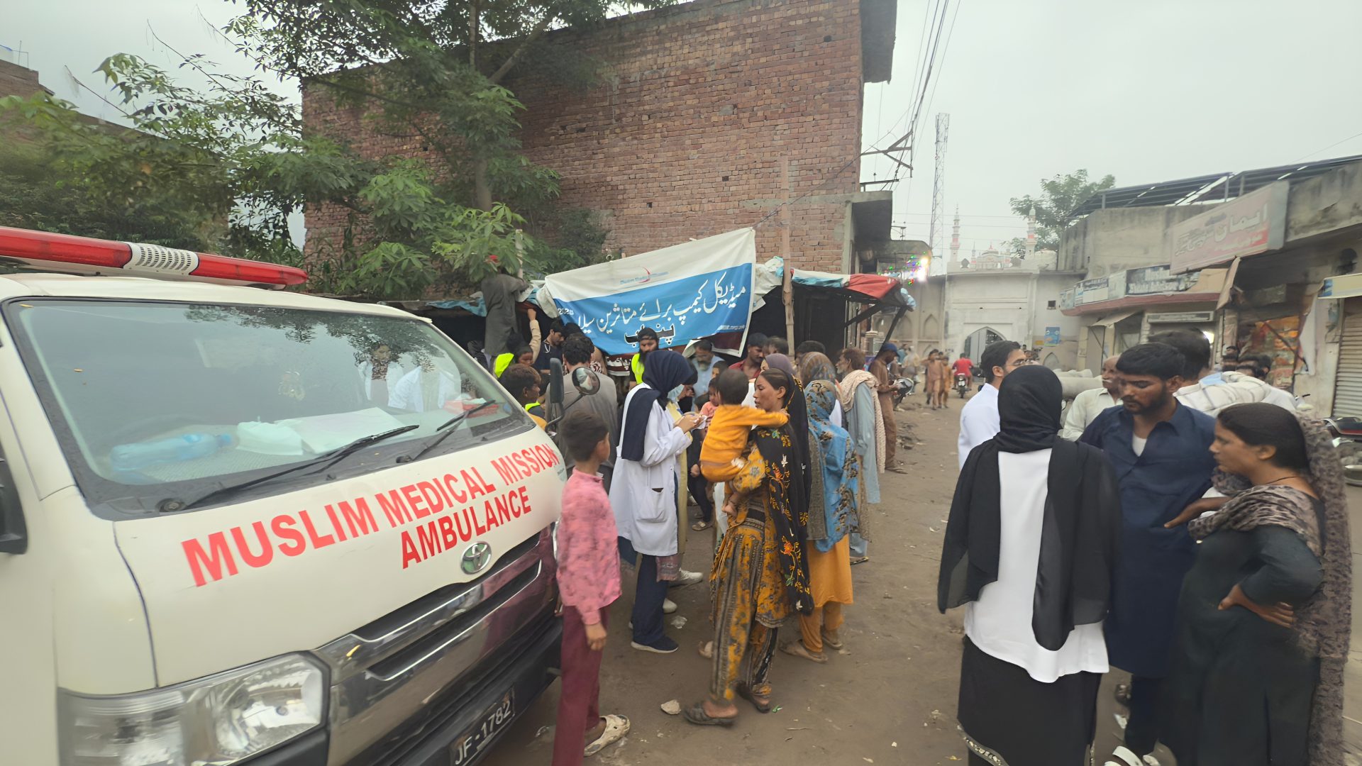 Muslim Medical Mission doctors conducting outpatient consultations and providing free medicine at a rural camp